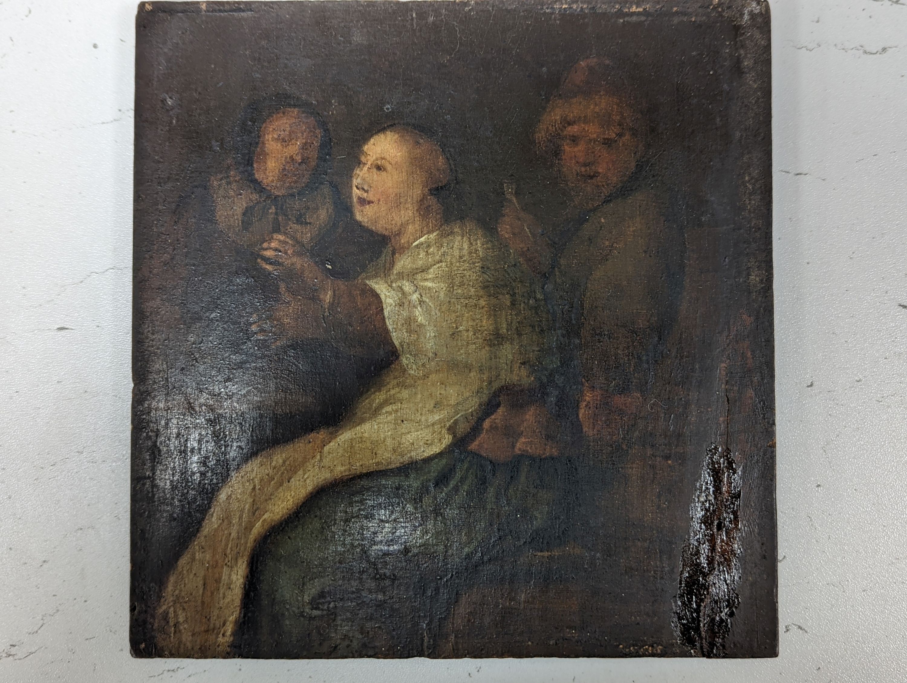 18th century English School, oil on panel, Interior with seated figures, 18.5 x 18cm, unframed